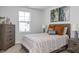 Bedroom featuring a dresser, bedside table, and a view of the window at 3928 Well Fleet Drive, Fuquay Varina, NC 27526