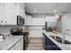 Kitchen with stainless steel appliances and granite countertops at 3928 Well Fleet Drive, Fuquay Varina, NC 27526