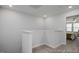 A loft area with neutral carpet and paint is a blank canvas ready for your inspiration at 3928 Well Fleet Drive, Fuquay Varina, NC 27526