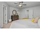 Primary bedroom with soft carpet, ceiling fan, and natural light at 3928 Well Fleet Drive, Fuquay Varina, NC 27526