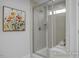Modern bathroom showcasing a glass-enclosed shower with tiled walls and built-in bench at 3928 Well Fleet Drive, Fuquay Varina, NC 27526