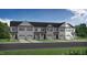 Modern three-unit townhouse building with garages at 3928 Well Fleet Drive, Fuquay Varina, NC 27526