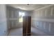 Blank canvas bedroom with fresh drywall and a window allowing outdoor views and lighting at 3930 Well Fleet Drive, Fuquay Varina, NC 27526