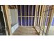 Bathroom under construction showing wood framing, plumbing and a new bathtub at 3932 Well Fleet Drive, Fuquay Varina, NC 27526