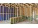 Partially framed open living room showcasing the framework and exposed utilities at 3932 Well Fleet Drive, Fuquay Varina, NC 27526