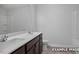 Bathroom featuring double sink vanity, tile floors, white countertop and shower and tub combination at 3932 Well Fleet Drive, Fuquay Varina, NC 27526