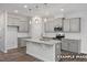 Stylish kitchen with stainless steel appliances and ample counter space at 3932 Well Fleet Drive, Fuquay Varina, NC 27526