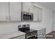 Stainless steel appliances and granite countertops in kitchen at 3932 Well Fleet Drive, Fuquay Varina, NC 27526