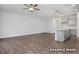 Inviting open-concept living space with hardwood floors and a view of the kitchen at 3932 Well Fleet Drive, Fuquay Varina, NC 27526