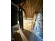 Unfinished attic with exposed rafters and plywood flooring at 40 Moonraker Dr, Spring Hope, NC 27882