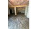 Spacious unfinished basement with concrete pillars and exposed insulation providing a blank canvas at 40 Moonraker Dr, Spring Hope, NC 27882