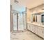 Bathroom features a double sink vanity with a tiled walk-in shower with glass doors at 40 Moonraker Dr, Spring Hope, NC 27882