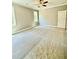 Bright bedroom with carpet, neutral paint, two windows, ceiling fan and door to closet at 40 Moonraker Dr, Spring Hope, NC 27882