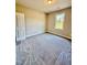 Cozy bedroom featuring neutral walls, plush carpeting, and a bright window at 40 Moonraker Dr, Spring Hope, NC 27882