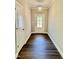 Traditional entryway featuring luxury vinyl plank floors and a transom window door at 40 Moonraker Dr, Spring Hope, NC 27882