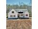 New construction home with white siding, black framed windows and stone accents at 40 Moonraker Dr, Spring Hope, NC 27882
