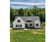 Charming home showcasing a bright green lawn and pristine white siding at 40 Moonraker Dr, Spring Hope, NC 27882