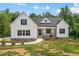 Charming two-story home with stone accents, black shutters, and well-manicured lawn at 40 Moonraker Dr, Spring Hope, NC 27882
