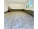Unfinished garage with concrete floor and staircase to upper level at 40 Moonraker Dr, Spring Hope, NC 27882