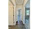 Bright hallway featuring hardwood floors and neutral paint, leading to bedrooms with new carpeting at 40 Moonraker Dr, Spring Hope, NC 27882