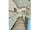 Updated kitchen with white cabinets, granite countertops, and luxury vinyl plank floors at 40 Moonraker Dr, Spring Hope, NC 27882