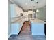 Bright kitchen features white cabinets, granite countertops, stainless appliances, and hardwood style flooring at 40 Moonraker Dr, Spring Hope, NC 27882