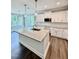 A kitchen with granite countertops, stainless appliances, white cabinets and hardwood style flooring at 40 Moonraker Dr, Spring Hope, NC 27882