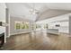 Spacious living room featuring a vaulted ceiling, fireplace, hardwood floors, and lots of natural light at 40 Moonraker Dr, Spring Hope, NC 27882