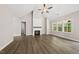 Inviting living room with vaulted ceilings, fireplace, and large windows offering scenic views and lots of natural light at 40 Moonraker Dr, Spring Hope, NC 27882