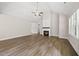 Expansive living room with vaulted ceilings, a fireplace, hardwood floors, and large windows at 40 Moonraker Dr, Spring Hope, NC 27882