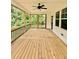 Relax on the large screened-in porch with views of the surrounding nature at 40 Moonraker Dr, Spring Hope, NC 27882