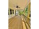 Charming screened porch with a ceiling fan, wooden floors and great backyard views at 40 Moonraker Dr, Spring Hope, NC 27882