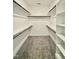 Walk-in closet with shelving and rods for optimal organization and storage solutions at 40 Moonraker Dr, Spring Hope, NC 27882