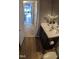 Bathroom featuring a vanity with a sink, toilet, and flooring at 42 Melstone Turn, Durham, NC 27707