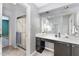 Bathroom with sink, vanity area, a large mirror and a separate shower featuring sliding glass doors at 42 Melstone Turn, Durham, NC 27707