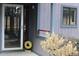 Entrance way into home with storm door, light gray siding, and dark gray trim at 42 Melstone Turn, Durham, NC 27707