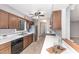 Functional kitchen with wooden cabinetry, stainless steel appliances, and a view of the sink and window at 42 Melstone Turn, Durham, NC 27707