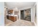 Open kitchen with sleek appliances, tile floors and sliding glass doors that provides access to an outdoor patio at 42 Melstone Turn, Durham, NC 27707