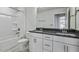 Bathroom with double vanity, grey countertop and shower tub combo at 7537 Percussion Dr, Apex, NC 27539