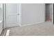 Neutral bedroom with carpet, light walls, and views to hall and window at 7537 Percussion Dr, Apex, NC 27539