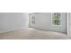 Spacious bedroom with neutral carpet, two windows providing lots of natural light at 7537 Percussion Dr, Apex, NC 27539