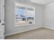 Bright bedroom featuring neutral carpet and natural light at 7537 Percussion Dr, Apex, NC 27539