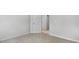 Neutral bedroom with carpet, light walls, and view to hall at 7537 Percussion Dr, Apex, NC 27539