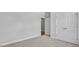 Neutral bedroom featuring double closets and light neutral carpet at 7537 Percussion Dr, Apex, NC 27539