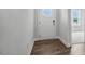 Welcoming home foyer with hardwood floors and white trim at 7537 Percussion Dr, Apex, NC 27539