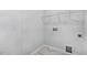 Laundry room with white walls, marble tile and storage at 7537 Percussion Dr, Apex, NC 27539