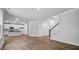 Spacious living area with an open floor plan, hardwood floors, and natural light at 7537 Percussion Dr, Apex, NC 27539