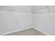 Walk-in closet with wire shelving, carpet floors and neutral paint at 7537 Percussion Dr, Apex, NC 27539