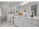 Beautiful bathroom features a vanity with a quartz countertop and a glass-enclosed shower at 7813 Ailesbury Rd, Wake Forest, NC 27587