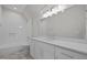 Bathroom with marble style floors, a tub, shower, and double sink vanity at 7813 Ailesbury Rd, Wake Forest, NC 27587